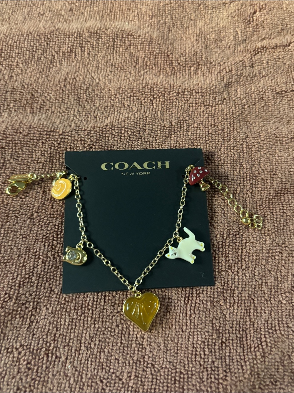 Coach Gold Tone Charm Necklace with Yellow Heart, White Cat & Red Mushroom
